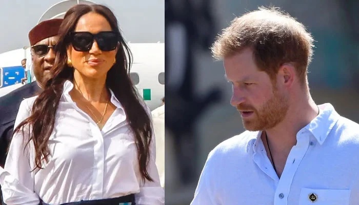 Prince Harry walking away from Meghan Markle